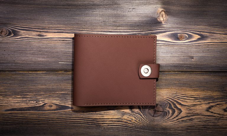 leather-wallet-on-the-rustic-wood-background-2021-08-26-17-12-31-utc-min